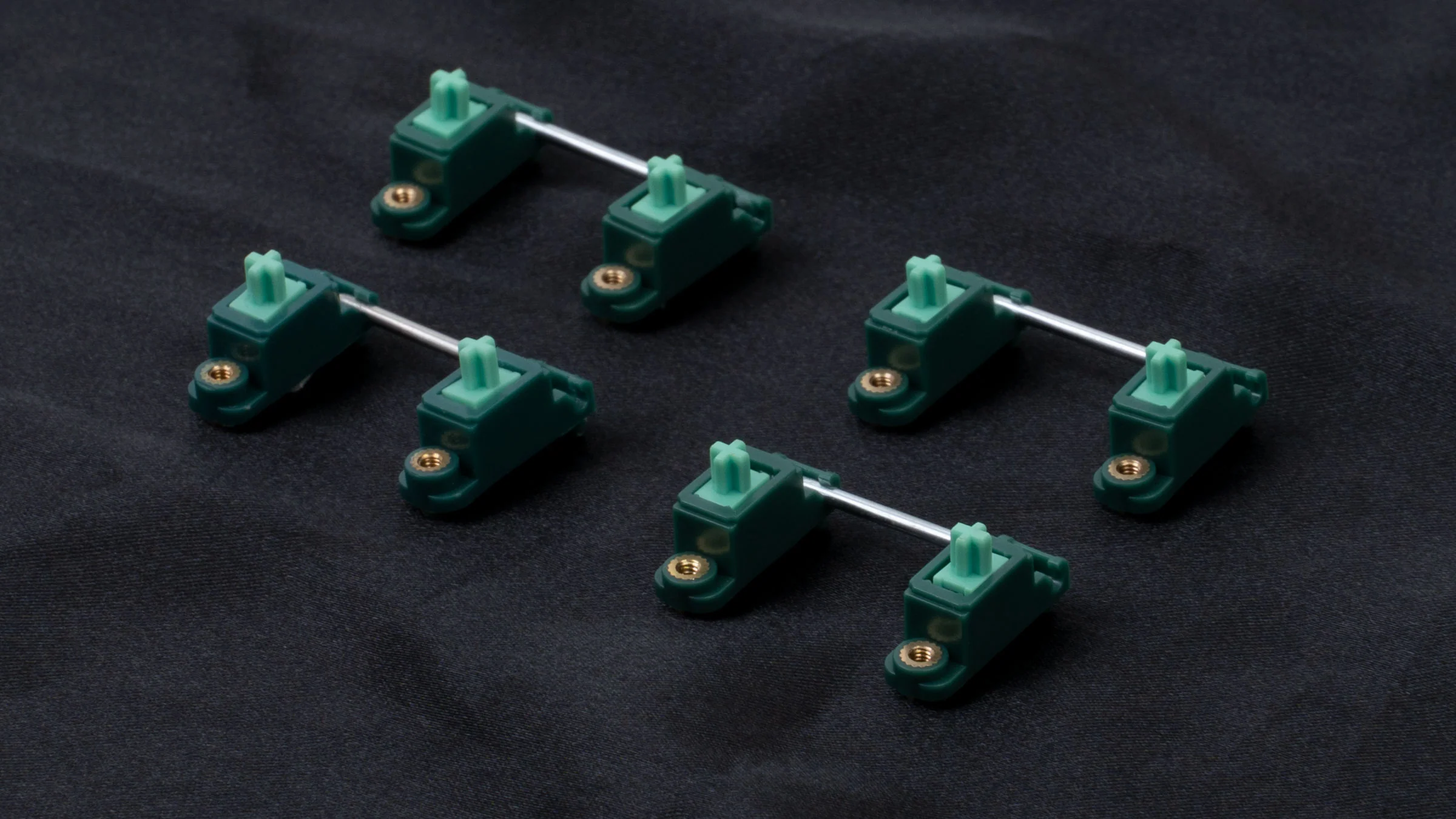 Close-up comparison of PBT dye-sub keycap legends against the premium doubleshot construction
